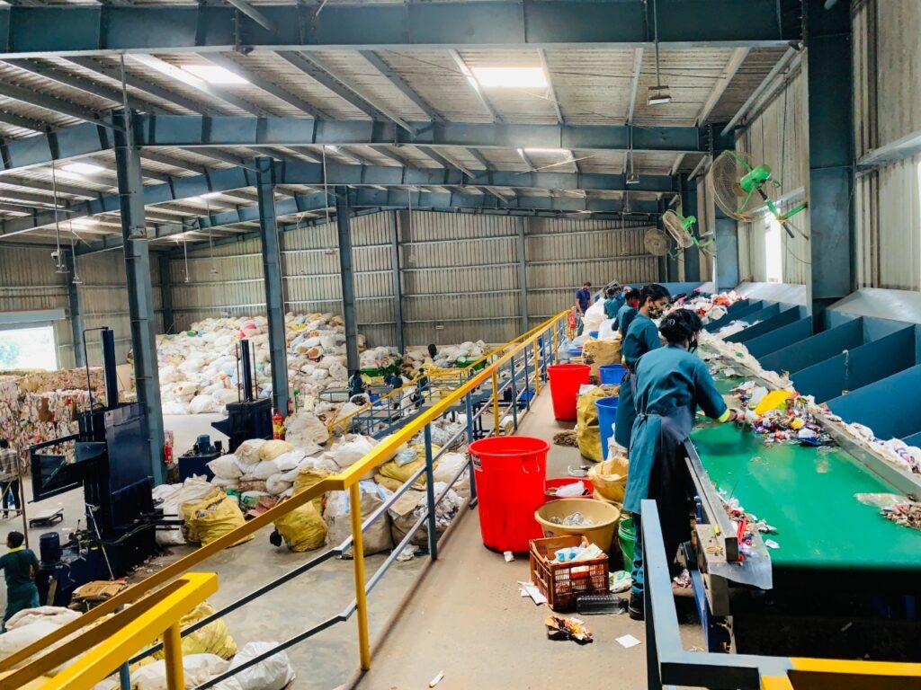 Sorting of collected segregated dry waste by women SHG workers at the MRF.